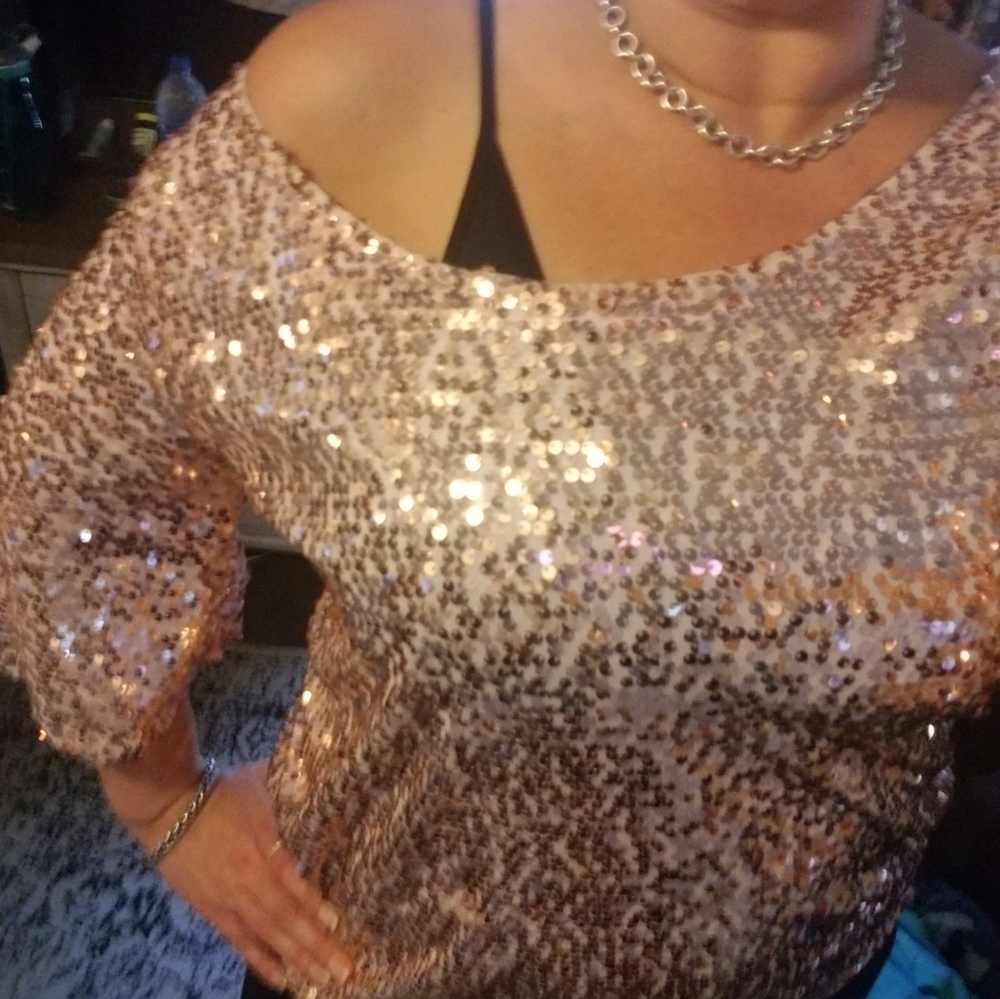 Rose goldish pink sequined top.